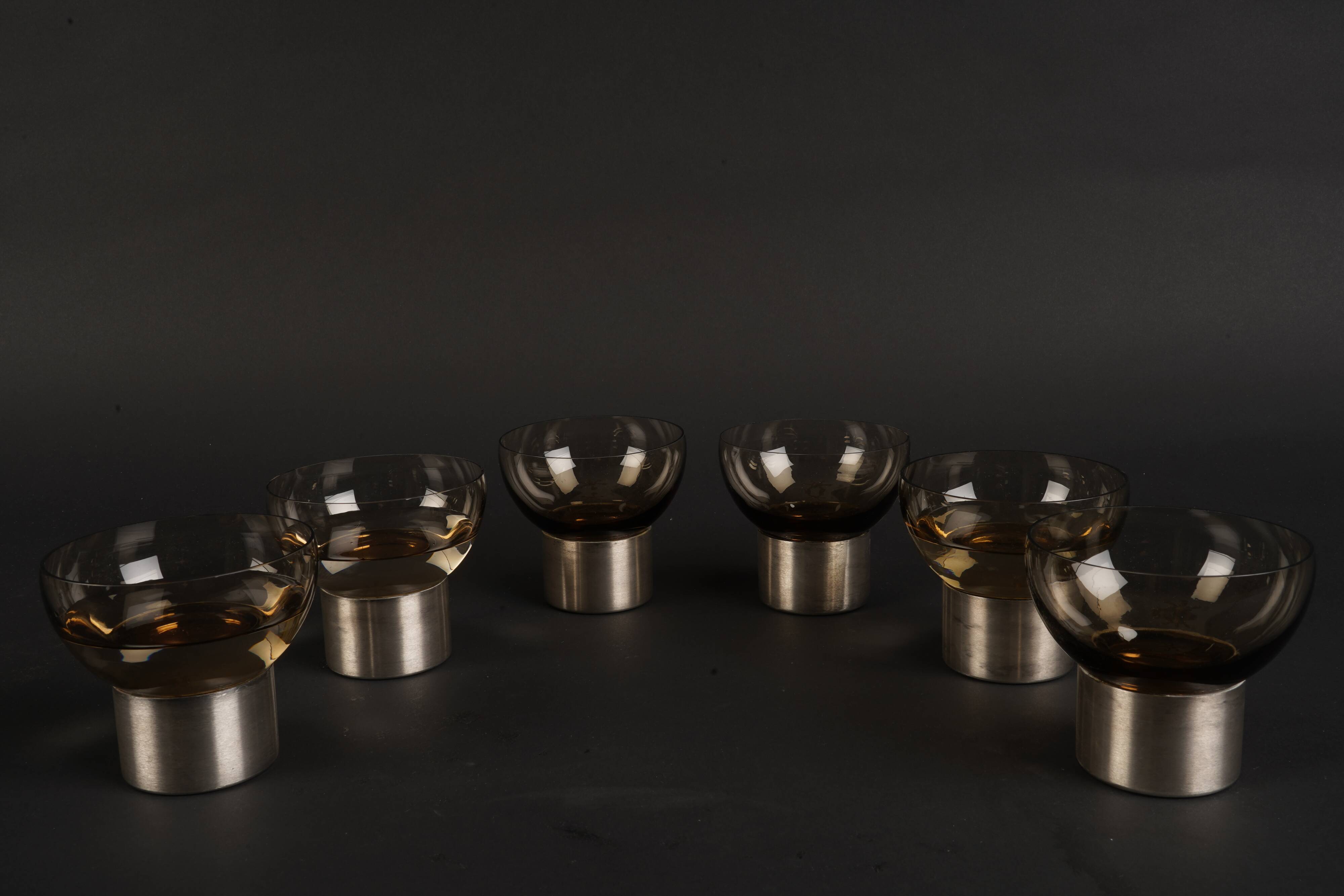 Set of six 1970s amber glass glasses mounted on brushed metal