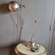 Old adjustable industrial lamp in bronze with 2 arms.