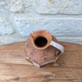Old small pitcher in glazed terracotta