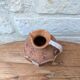 Old small pitcher in glazed terracotta