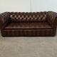 Light brown leather chesterfield sofa upholstered