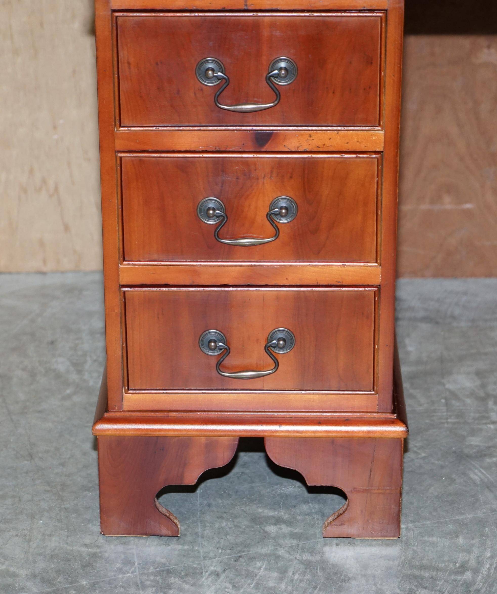 Vintage walnut desk with a leather top and two drawers.