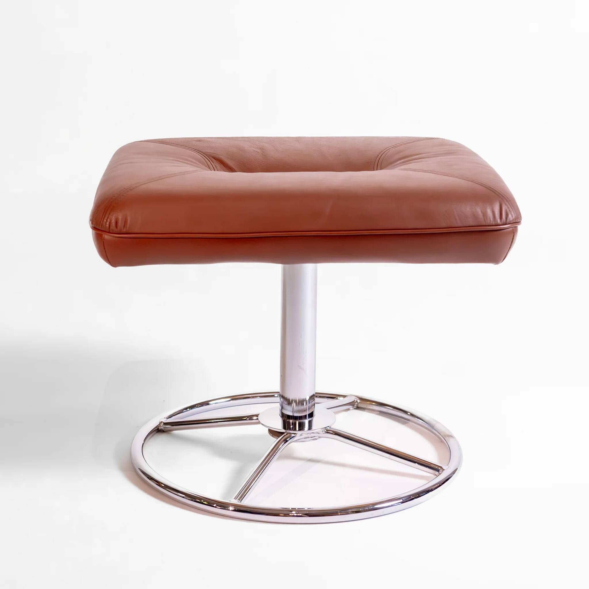 Vintage Scandinavian ottoman in brown leather with a chrome round base.