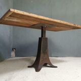Old table on cast iron machine leg