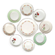 Old mismatched earthenware dessert plates with gold accompanied by a dish