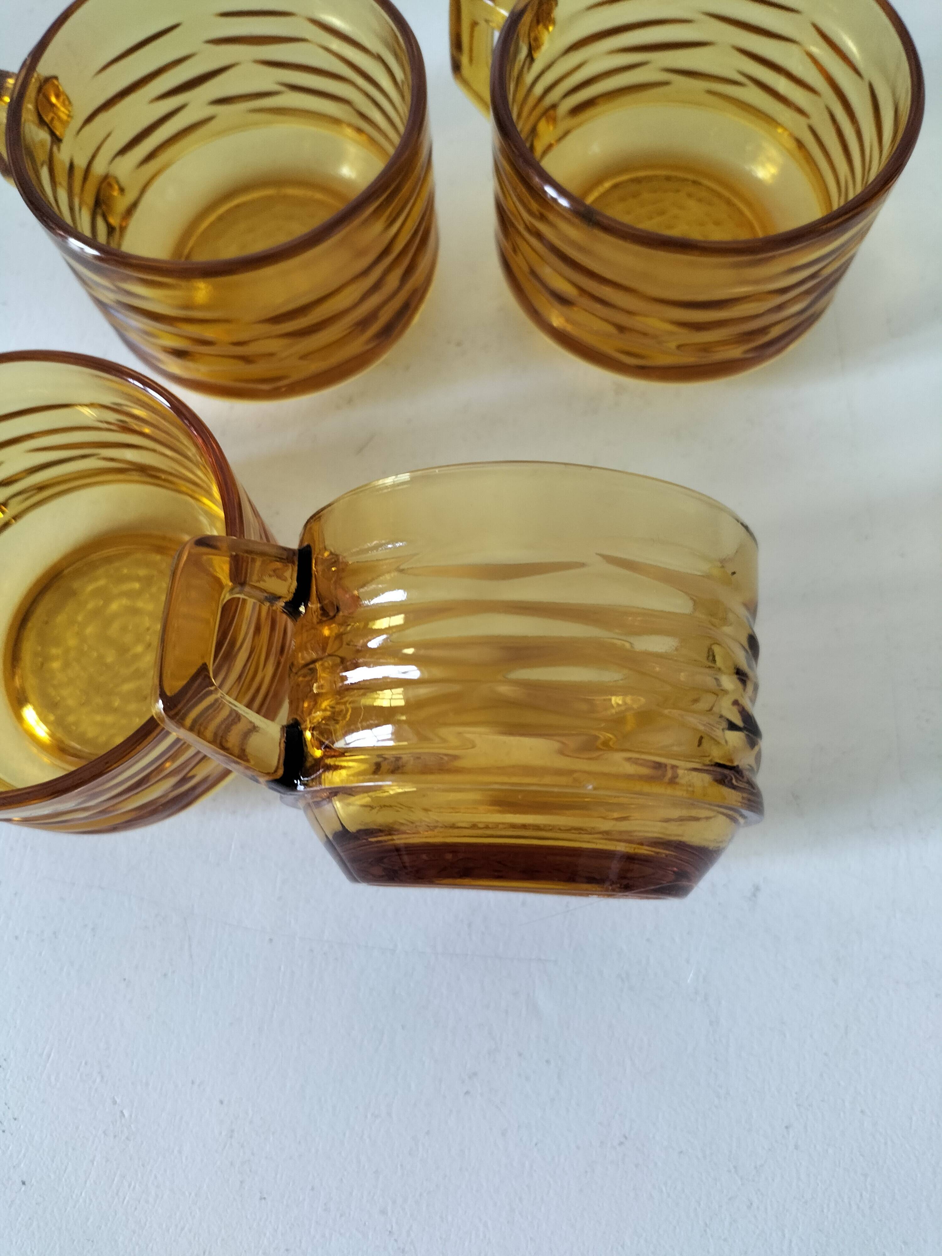 Set of 4 vintage amber glass mugs with textured 70s design