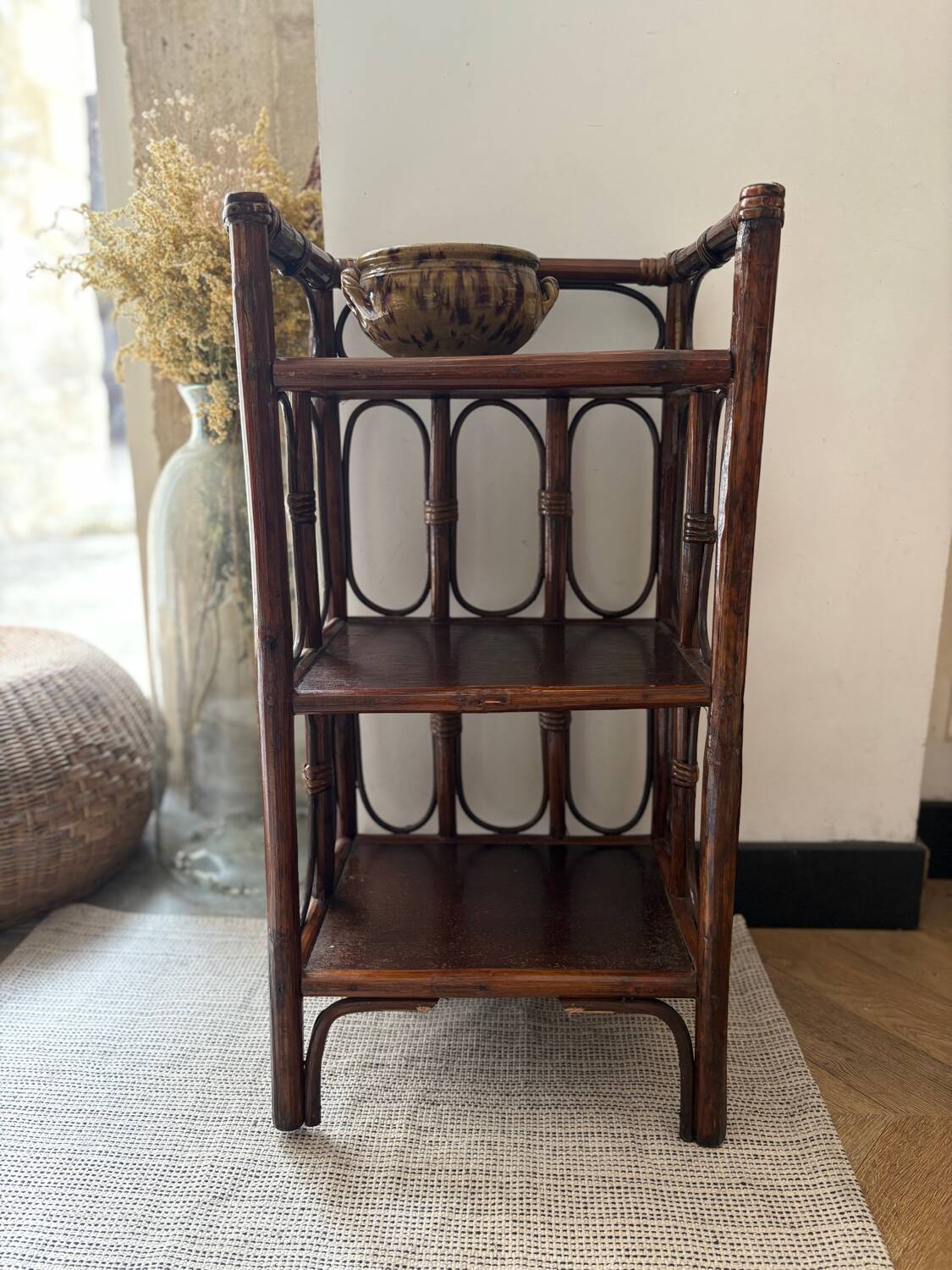 Dark brown 70s bamboo and cane shelf on legs