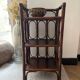 Dark brown 70s bamboo and cane shelf on legs