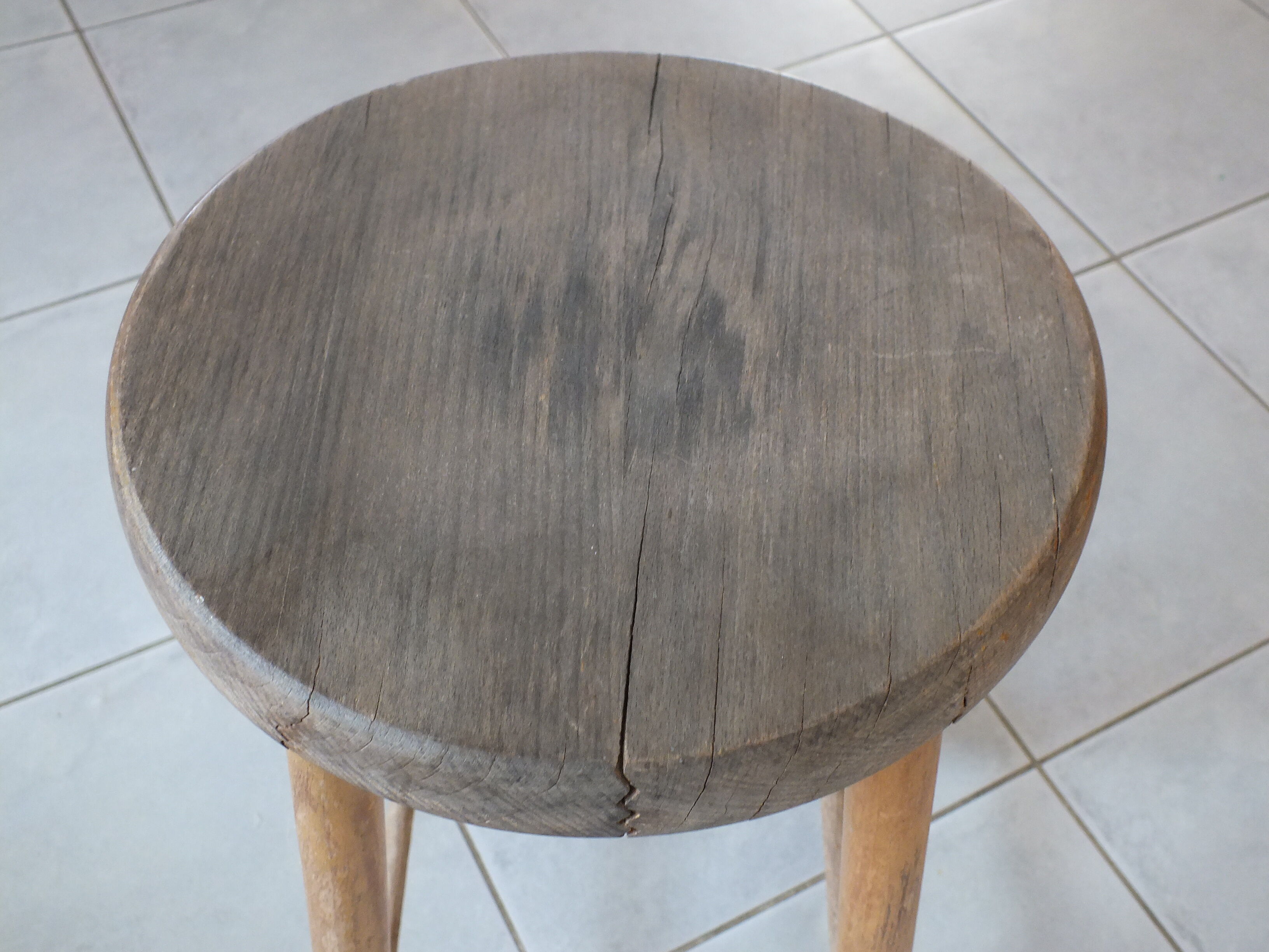 Vintage stool in patinated natural wood