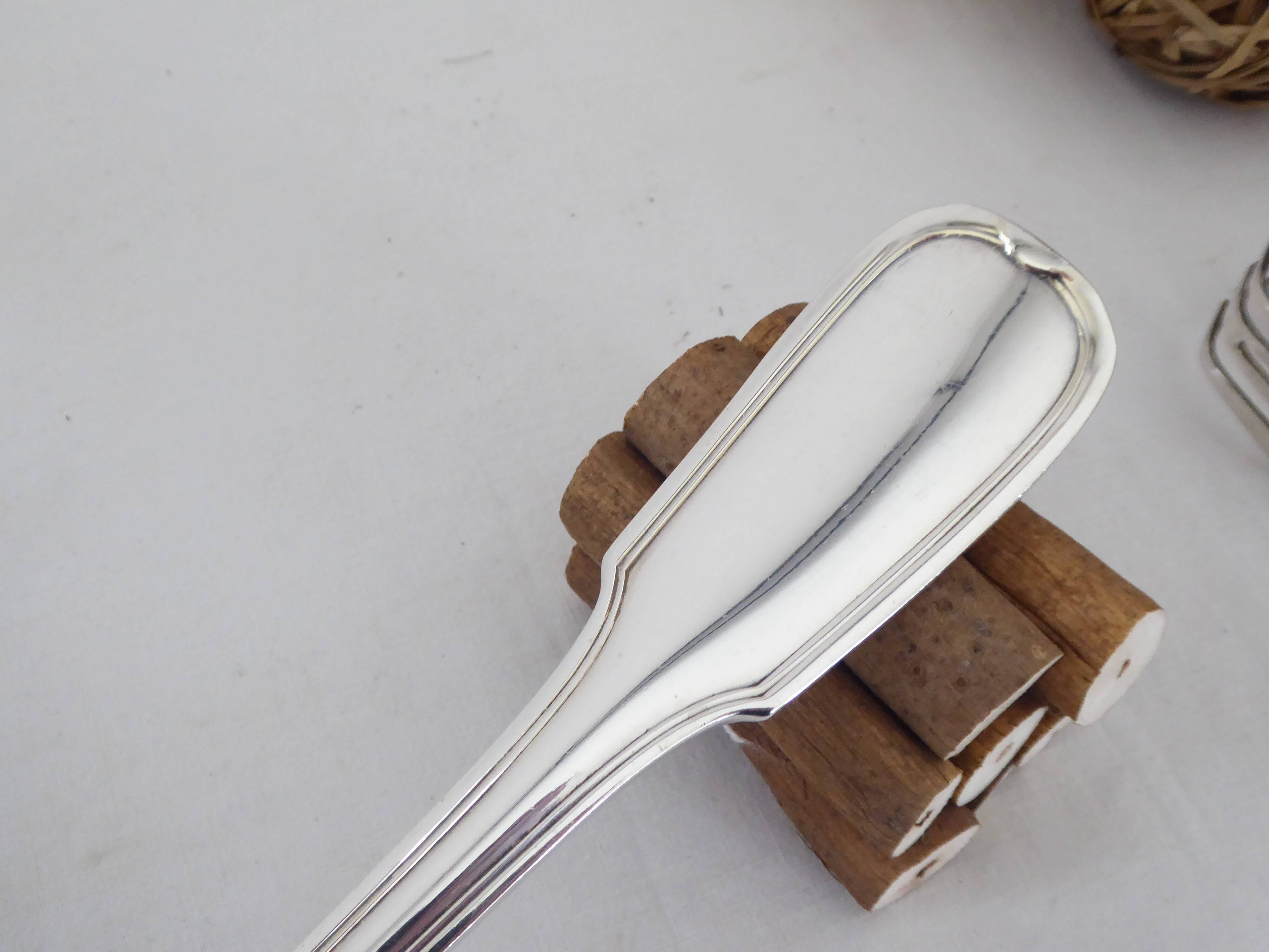 Silver metal ladle