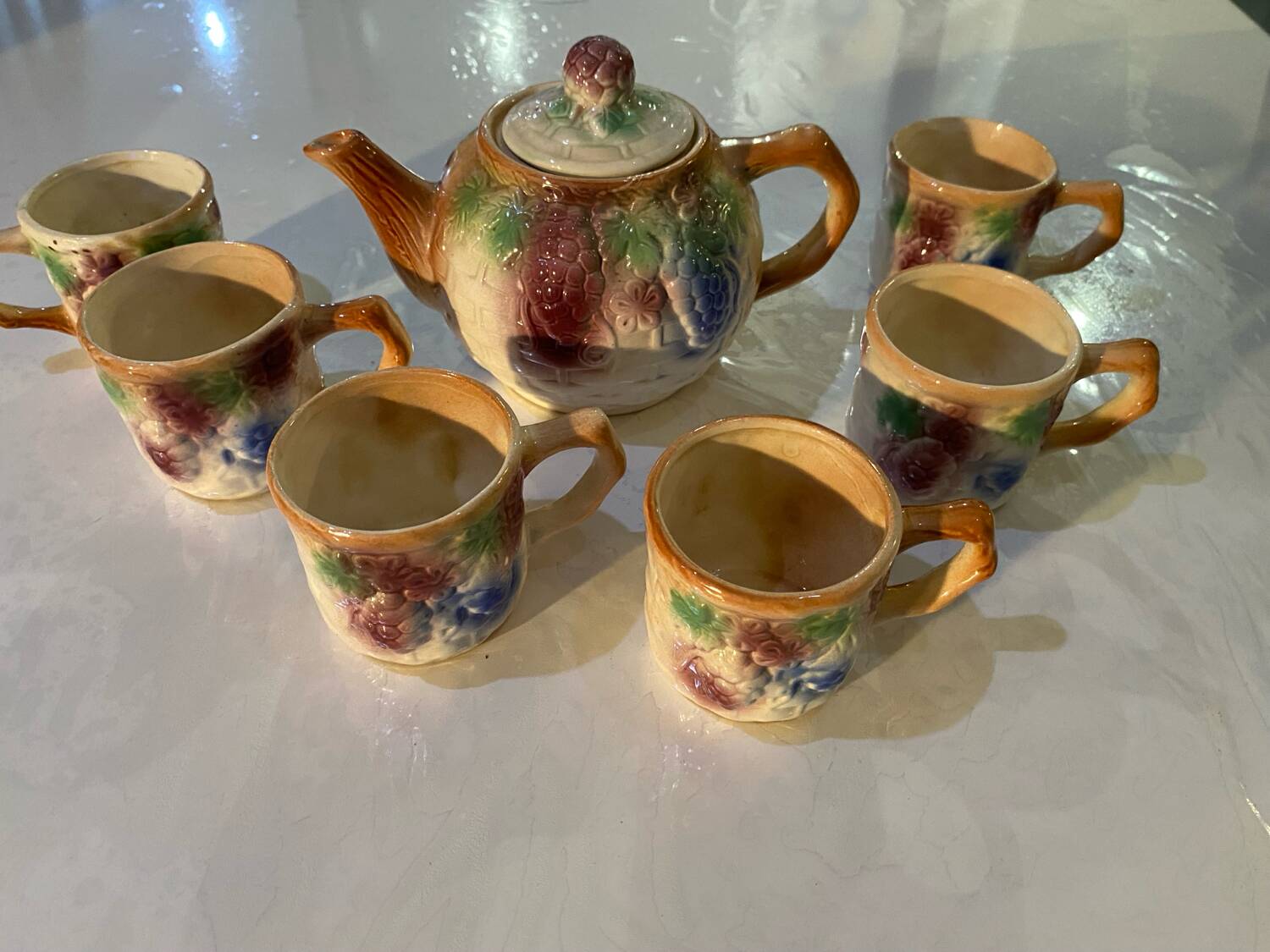 Vintage earthenware teapot and cup set