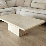 Beige travertine coffee table in the style of Italian design, 120 x 60 cm.