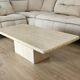 Beige travertine coffee table in the style of Italian design, 120 x 60 cm.