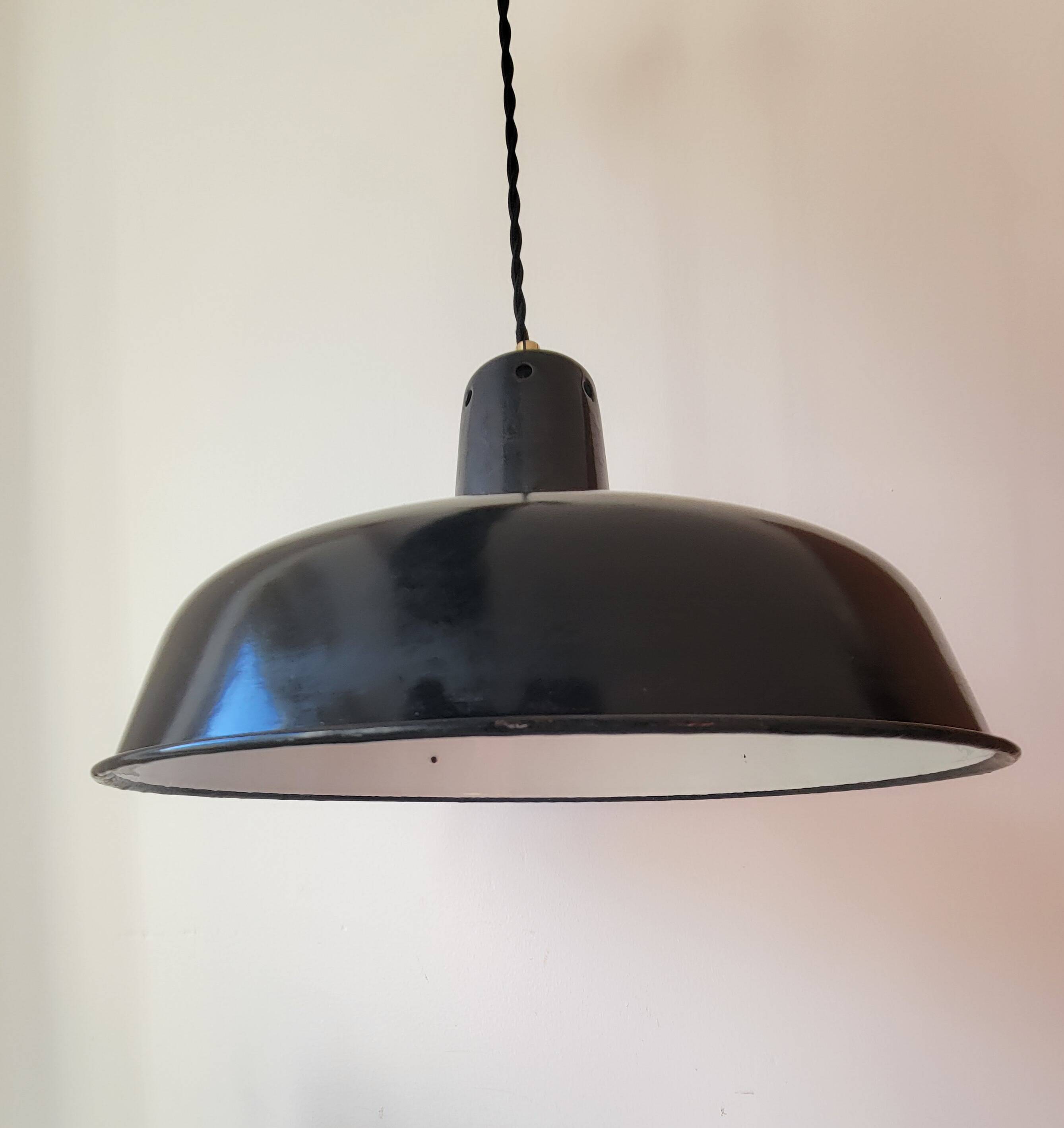 Duo of white and black enameled sheet metal pendants