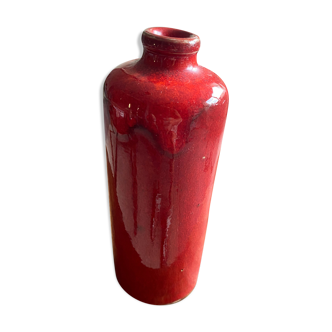 Red vase shaped bottle