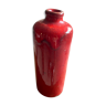 Red vase shaped bottle