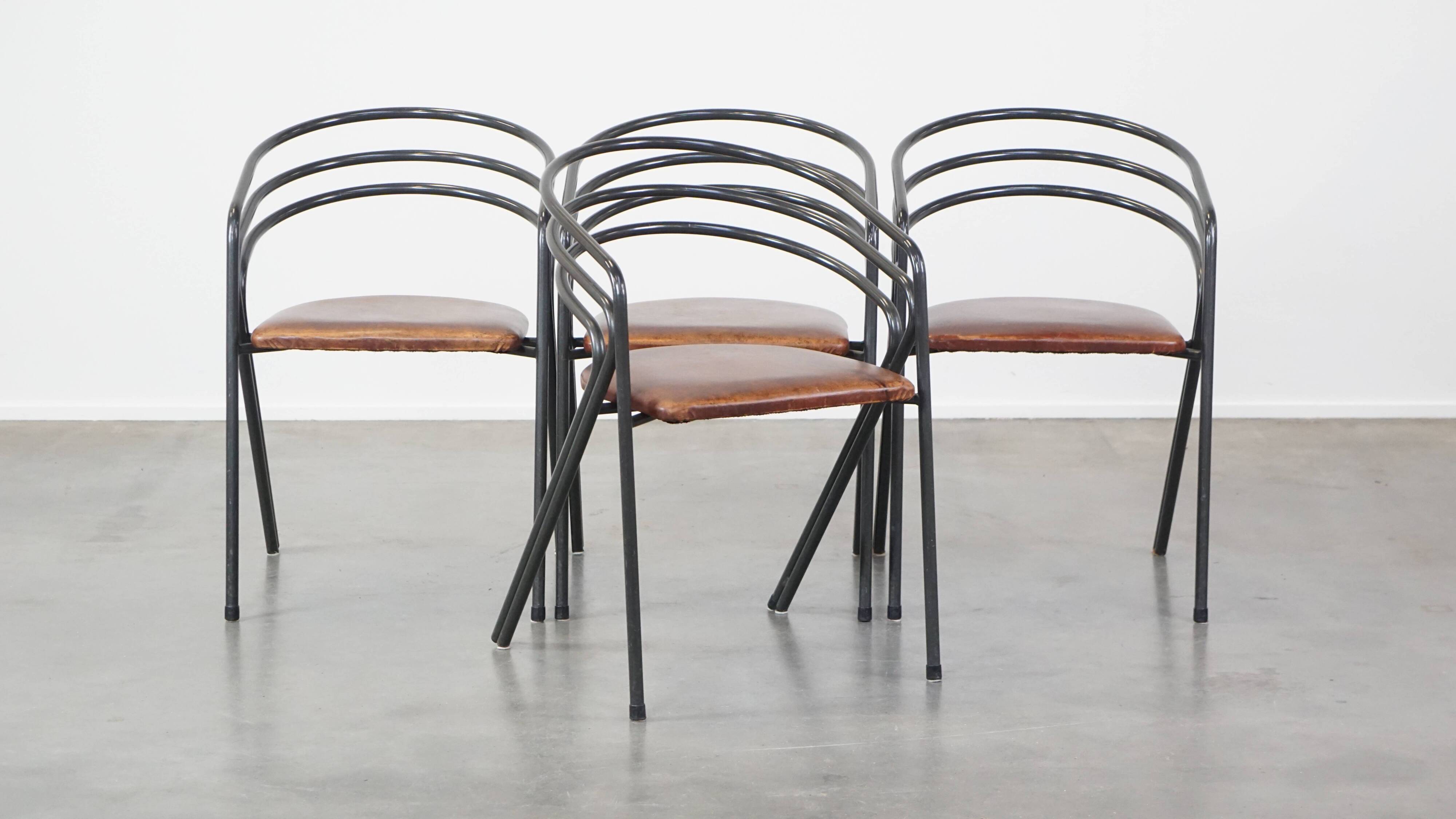 Set of 4 1970s design dining chairs with leather seats and metal frame