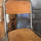 Pair of vintage adult school chairs in patinated metal