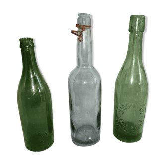 Set of three old bottles of green moulded glass