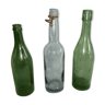 Set of three old bottles of green moulded glass