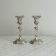 Pair of patinated silver-plated candlesticks