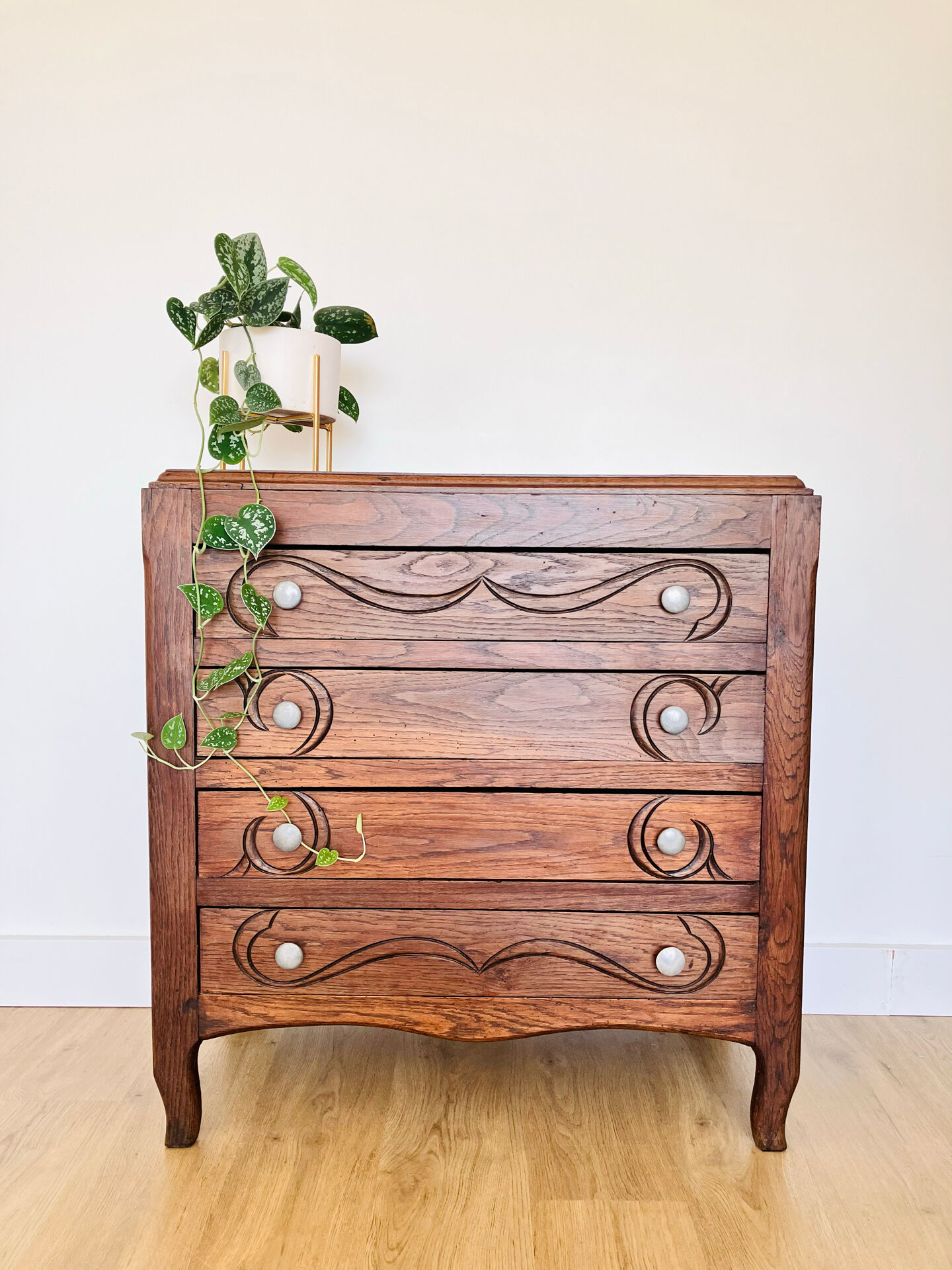 Antique commode with carved relief