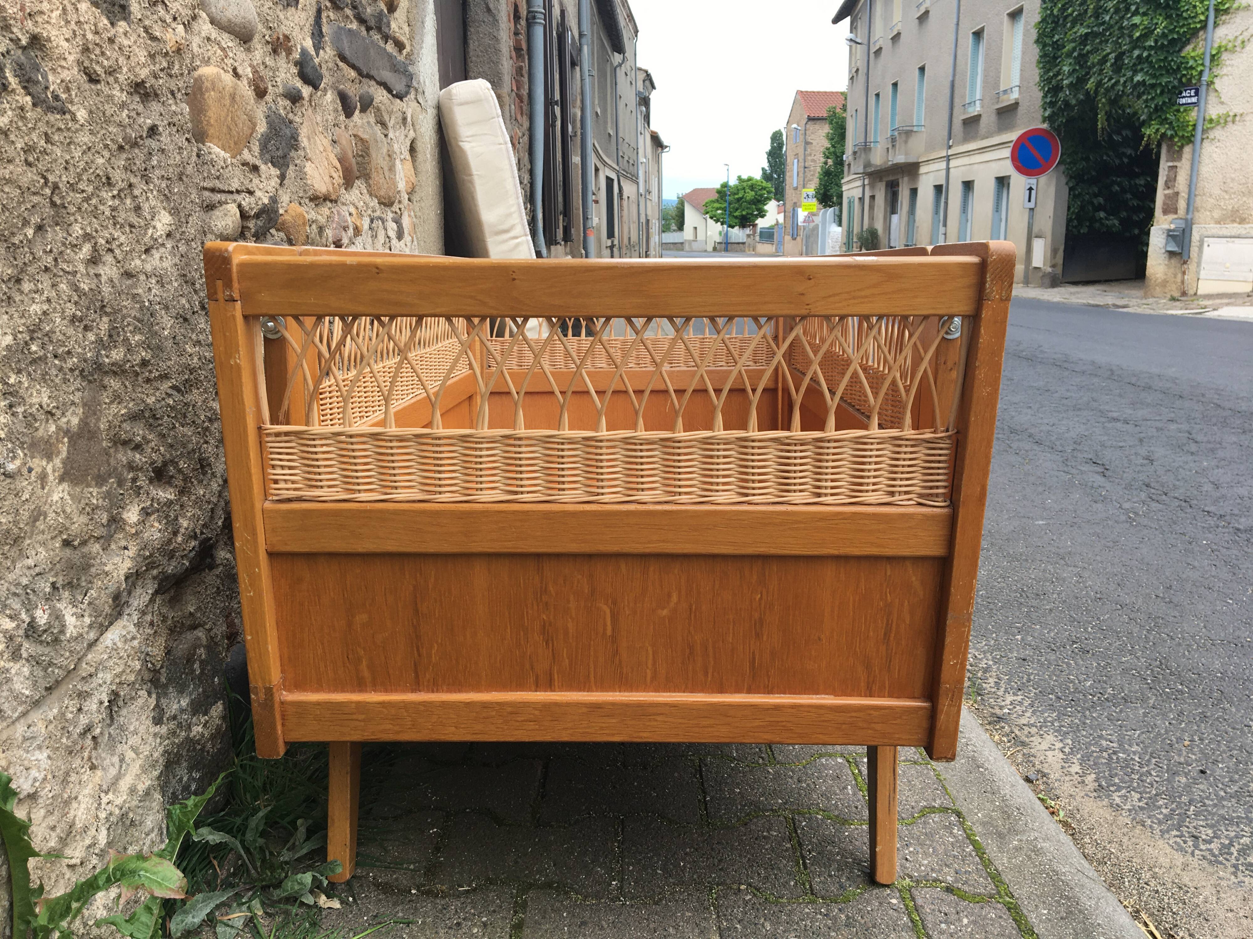 Wooden and rattan baby bed