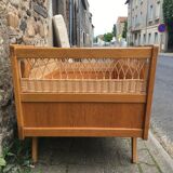 Wooden and rattan baby bed