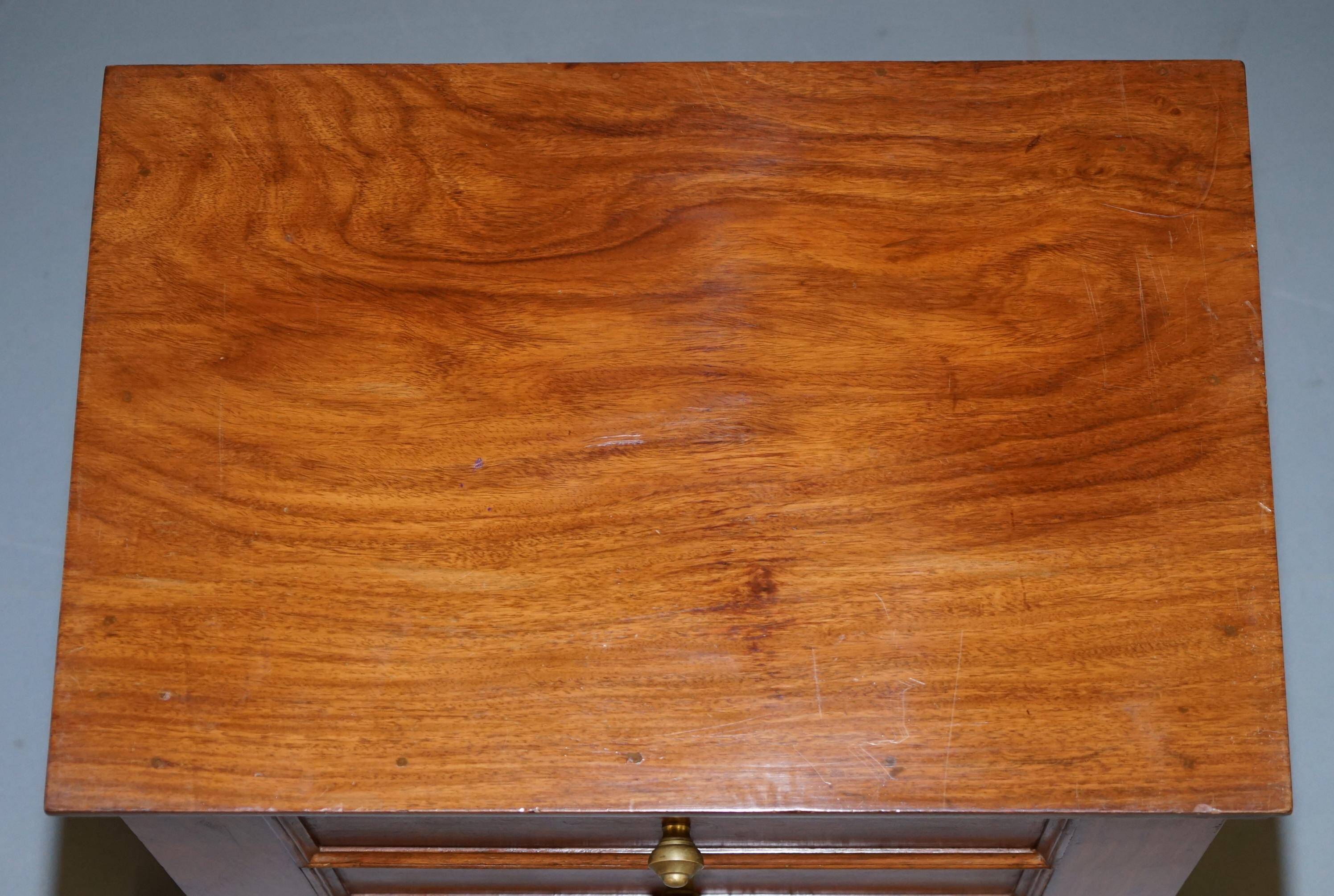 Set of hardwood dressers with finely carved bases.