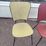 Set of 3 vintage yellow and red faux leather chairs.