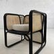 Cubic armchair in black rattan and canework