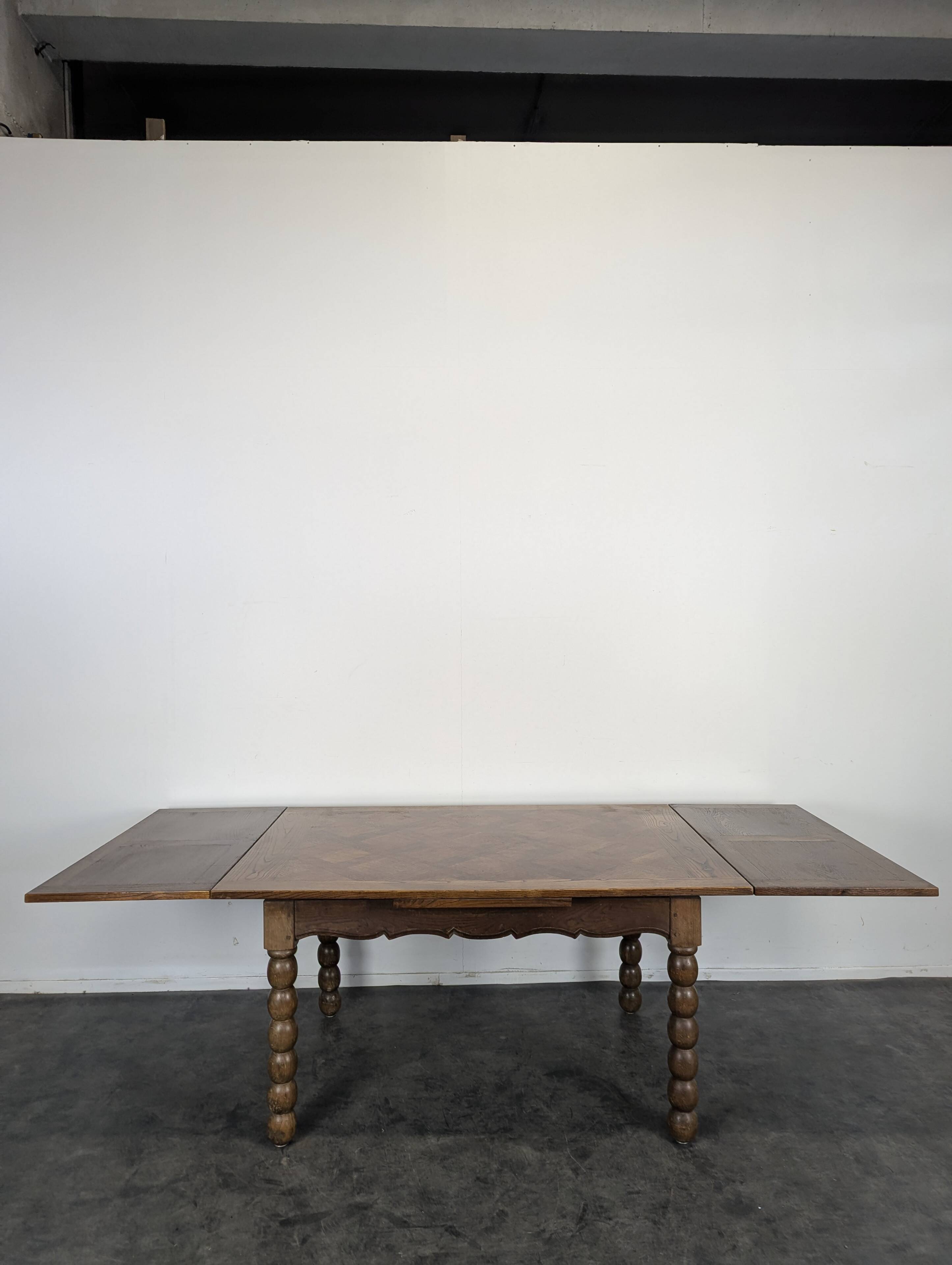 Dining table with turned oak legs.