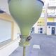 Antique green-painted iron floor lamp with a floral design.