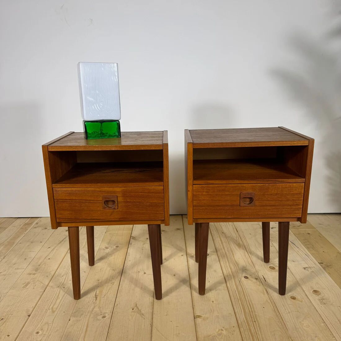Pair of mid-century modern teak bedside tables with drawer.