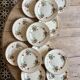 Set of 12 old flat plates with flower decorations - Salins