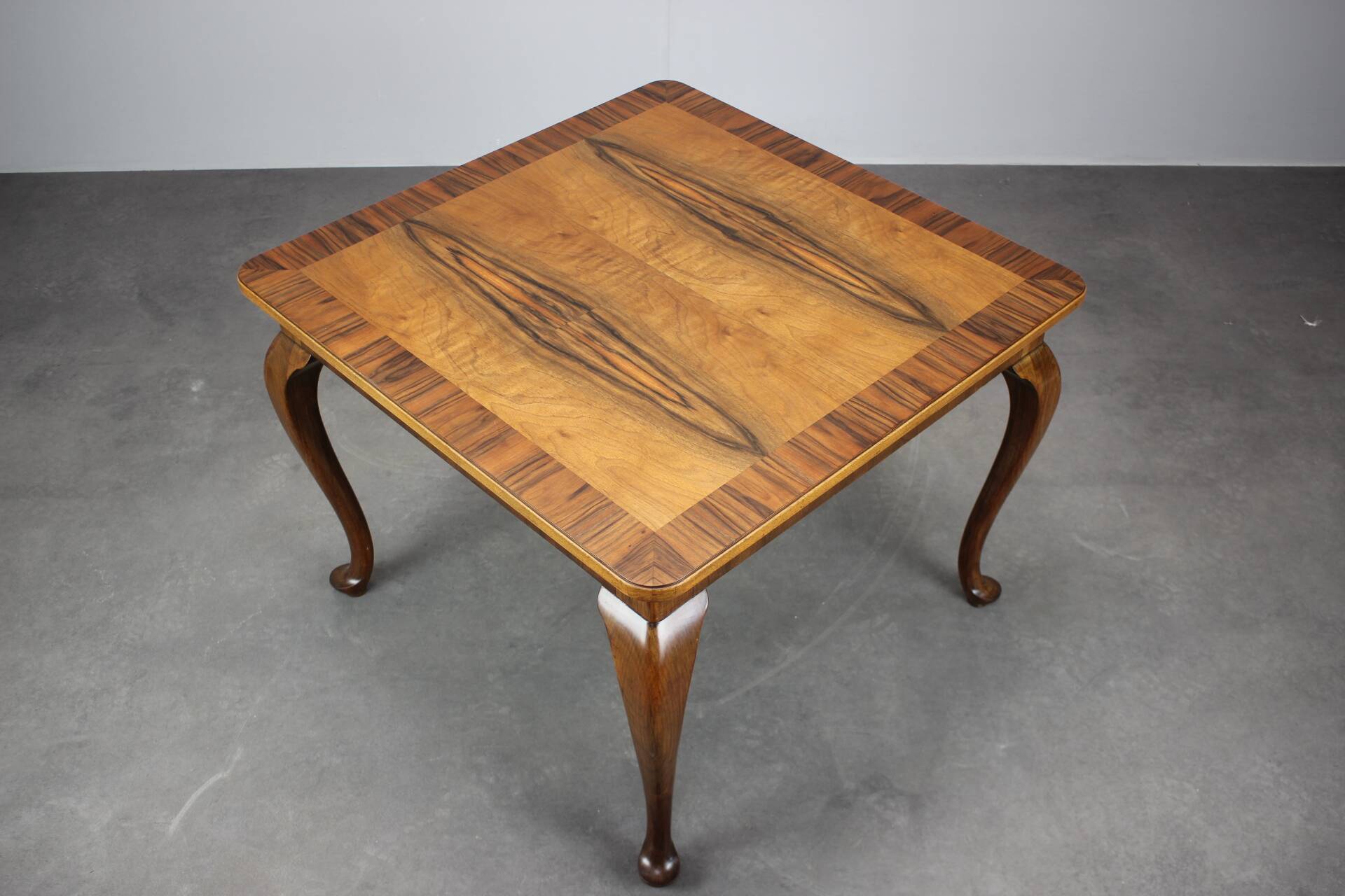 European Art Deco square coffee table from the 1930s in walnut veneer with a restored oiled finish