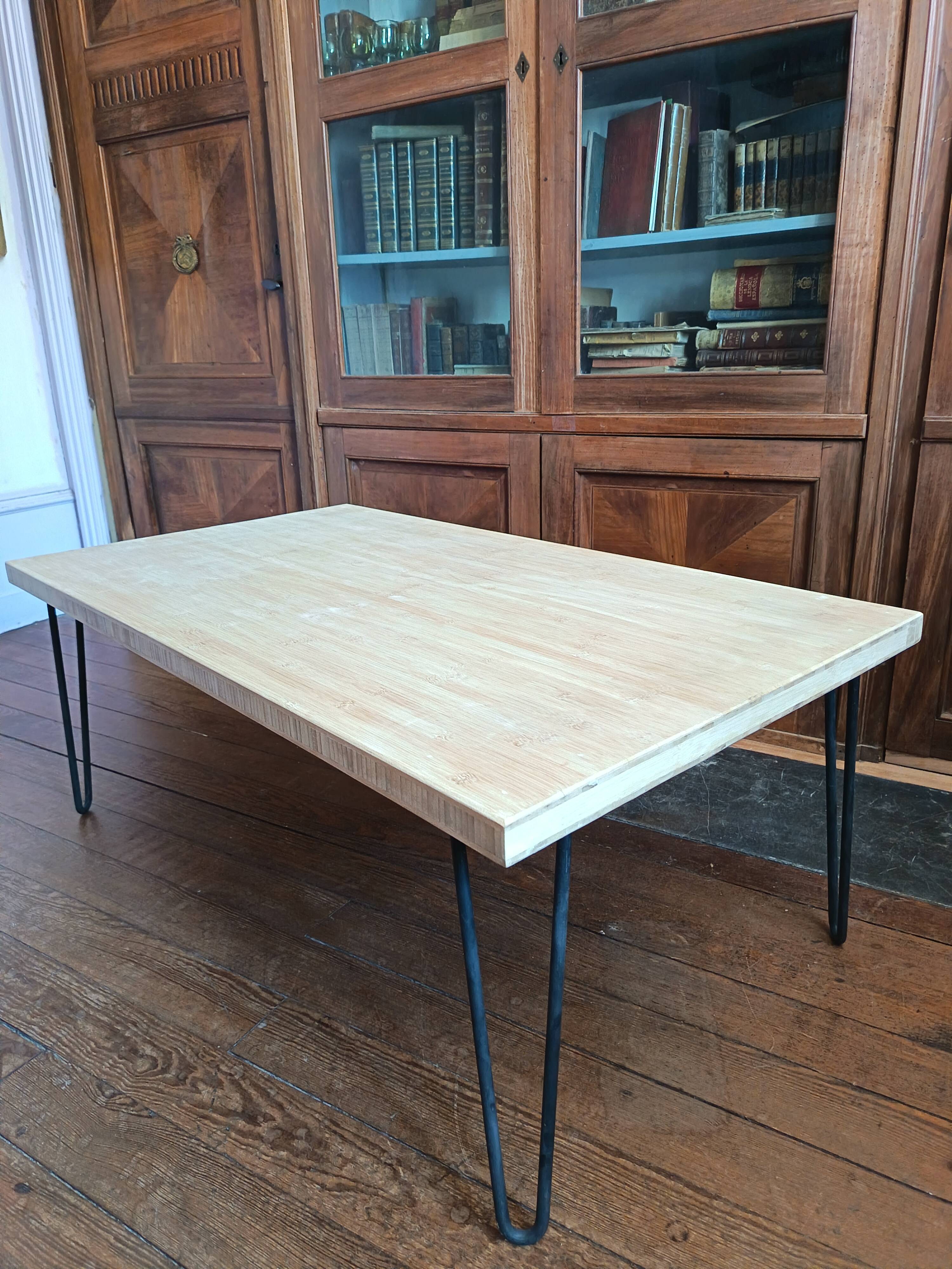 Coffee table in solid bamboo with steel legs.