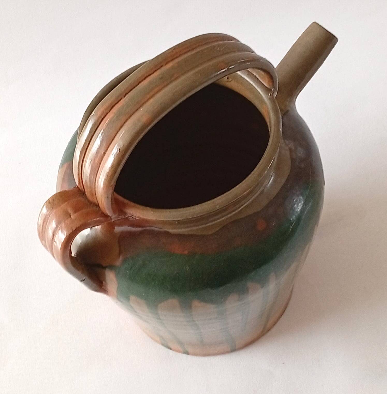 Glazed stoneware jug with drips