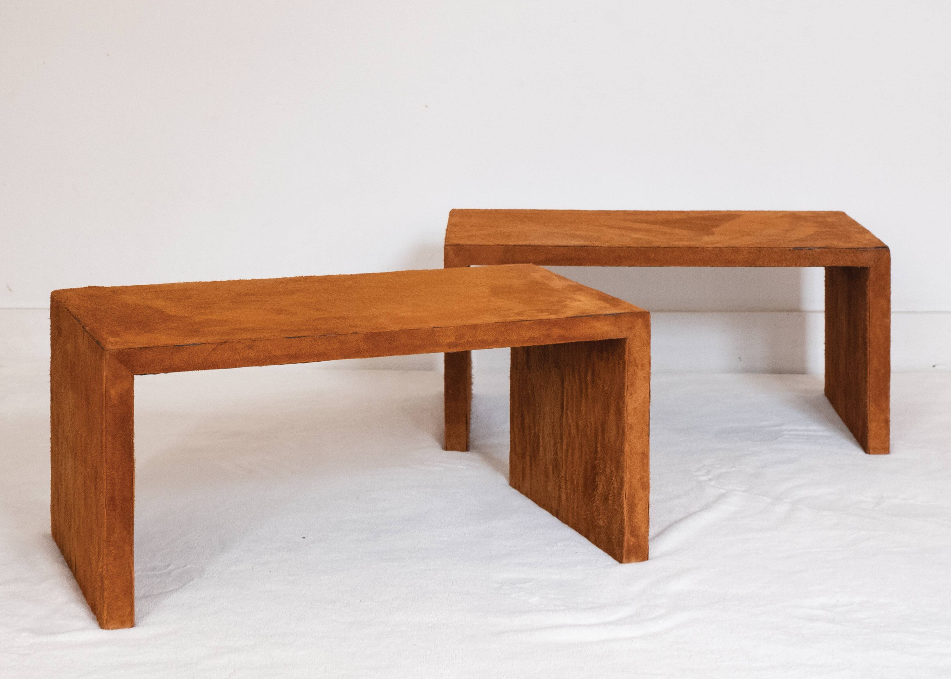 Pair of cognac suede side tables in the style of Jean Michel Frank.