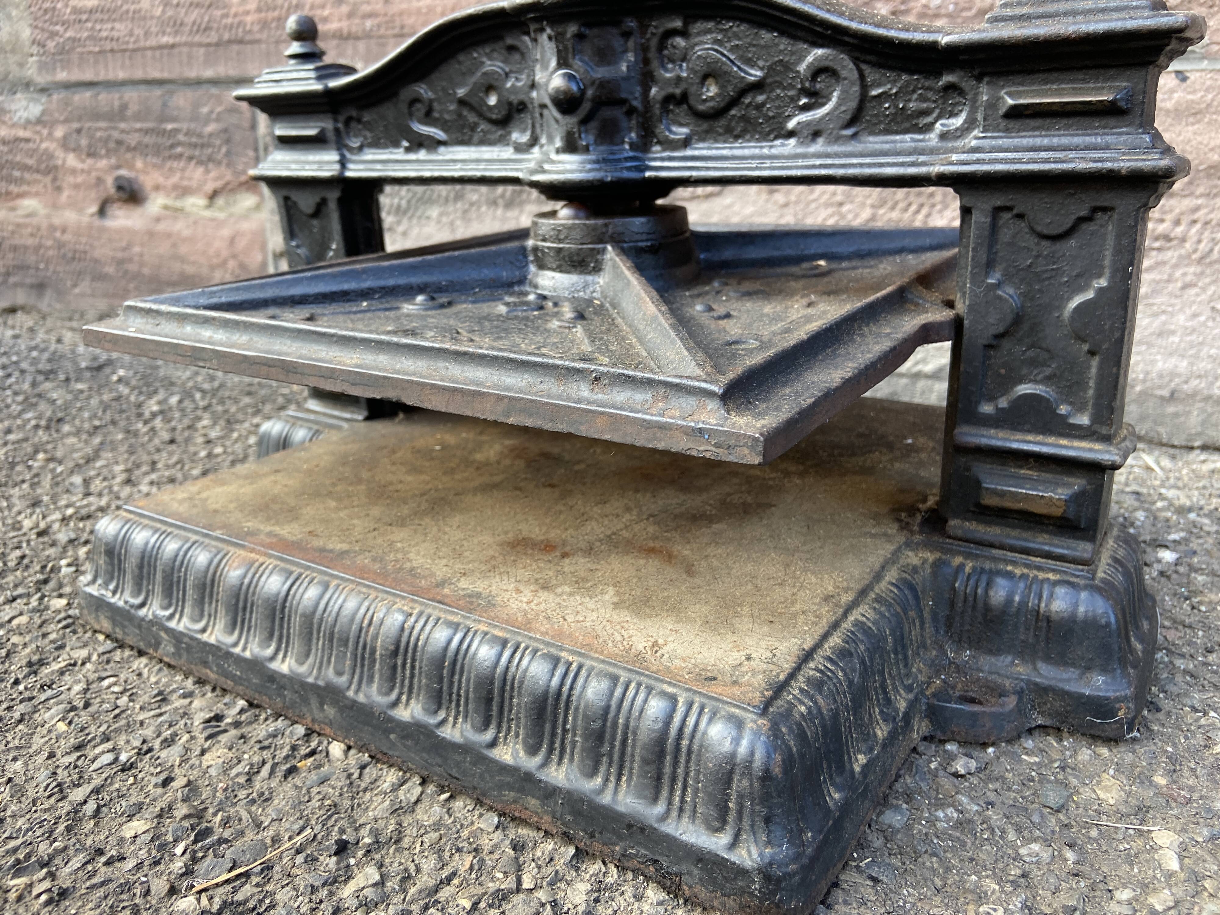 Old printing press in very old cast iron