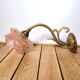 Old pink and golden brass wall lamp