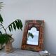 Miroir en bois, sculpté à décor de fleurs