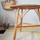 Round soft pink rattan table