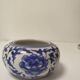 Small round Chinese-style porcelain pot with blue and white decoration