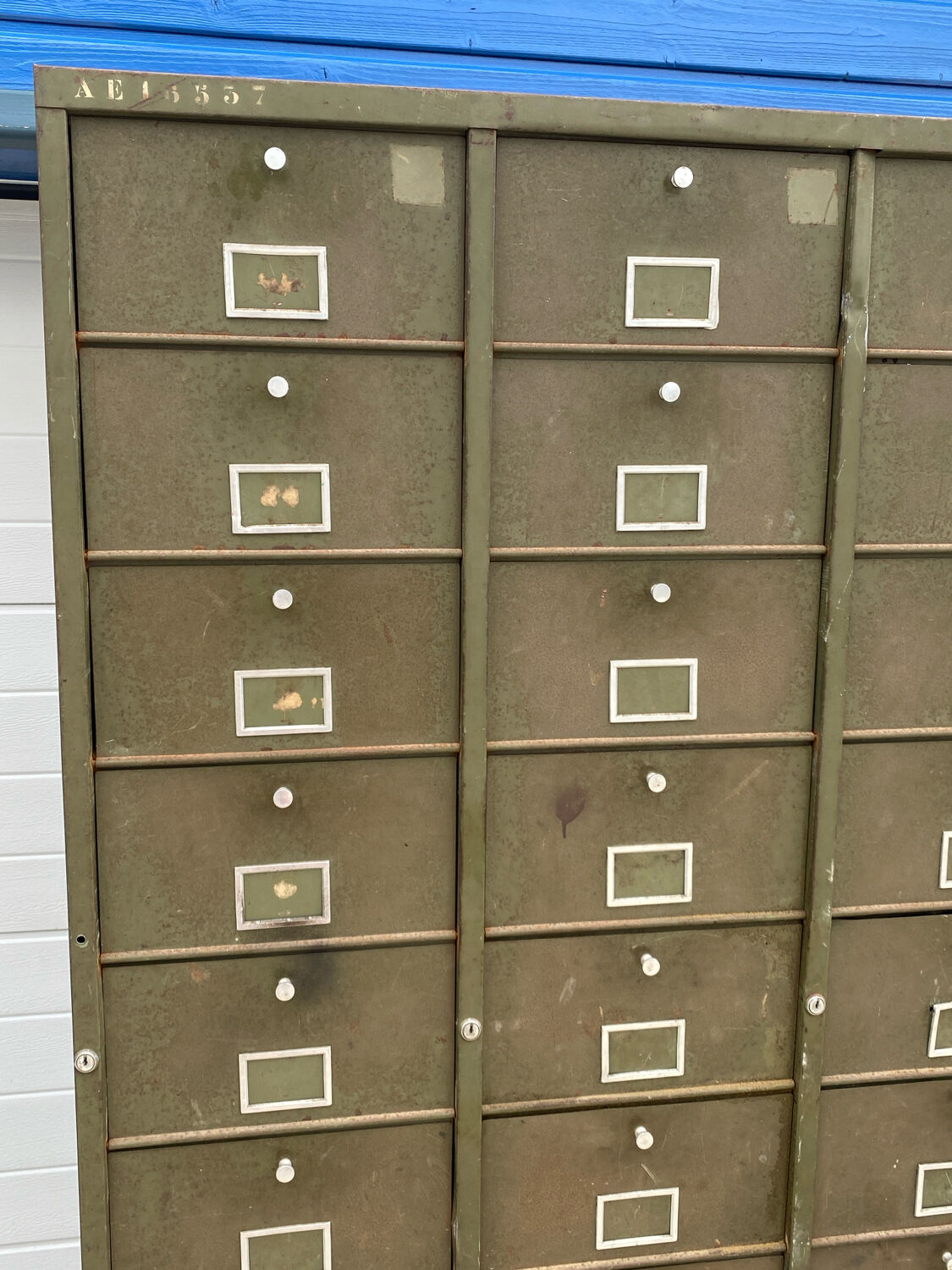 Military metal cabinet with hinged door