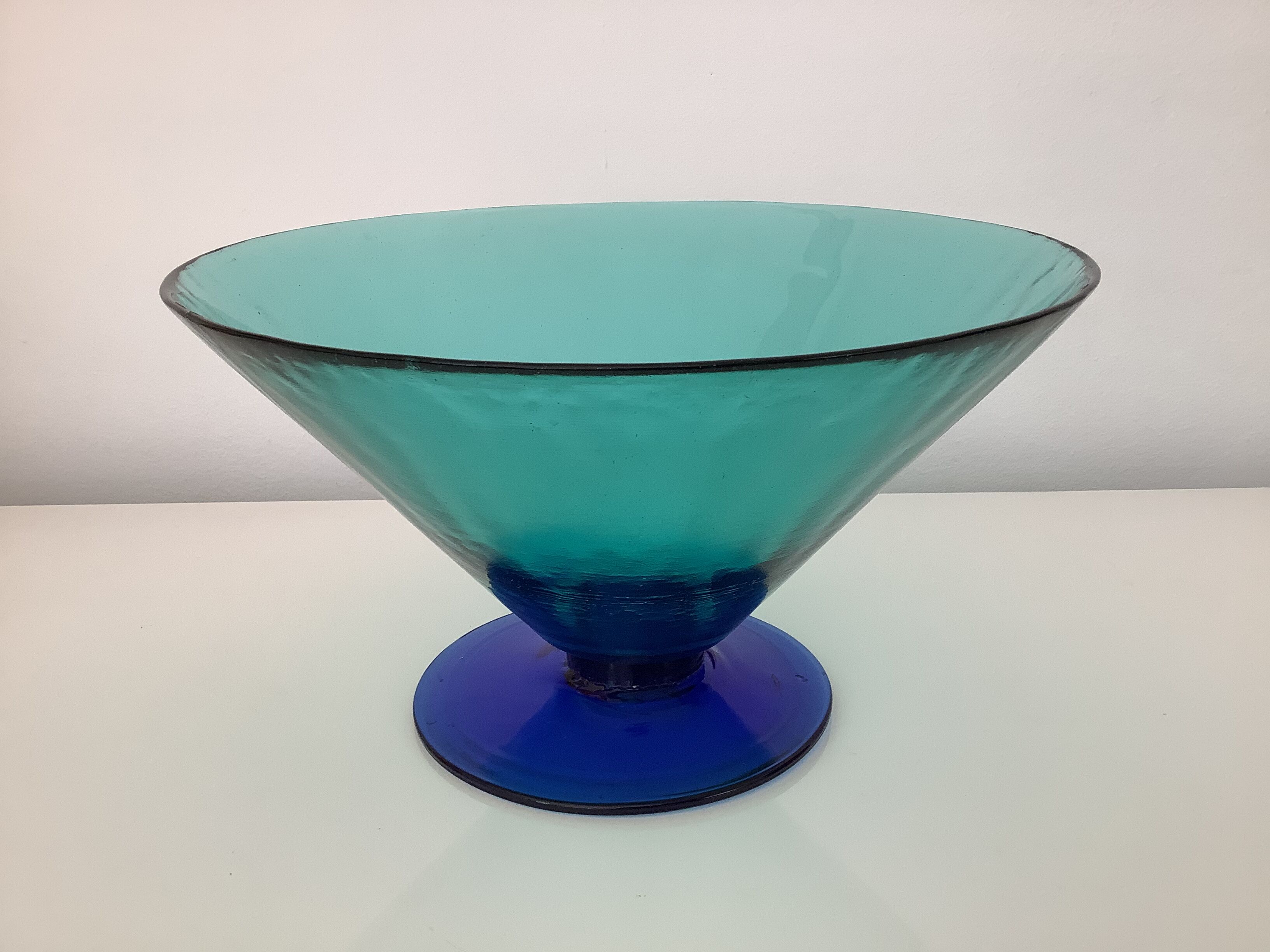 Glass fruit cup on foot, green and blue