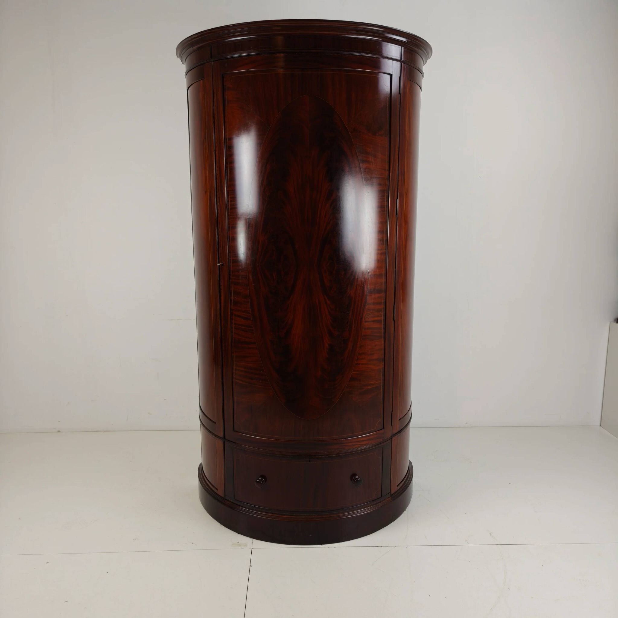 Edwardian mahogany bow-fronted wardrobe by Maple & Co