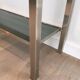 Beautiful console table in brushed metal with bluish glass shelves