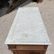 Commode with a white marble top