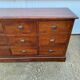 Old and authentic trade storage unit counter with 12 large drawers in cherry wood 1950